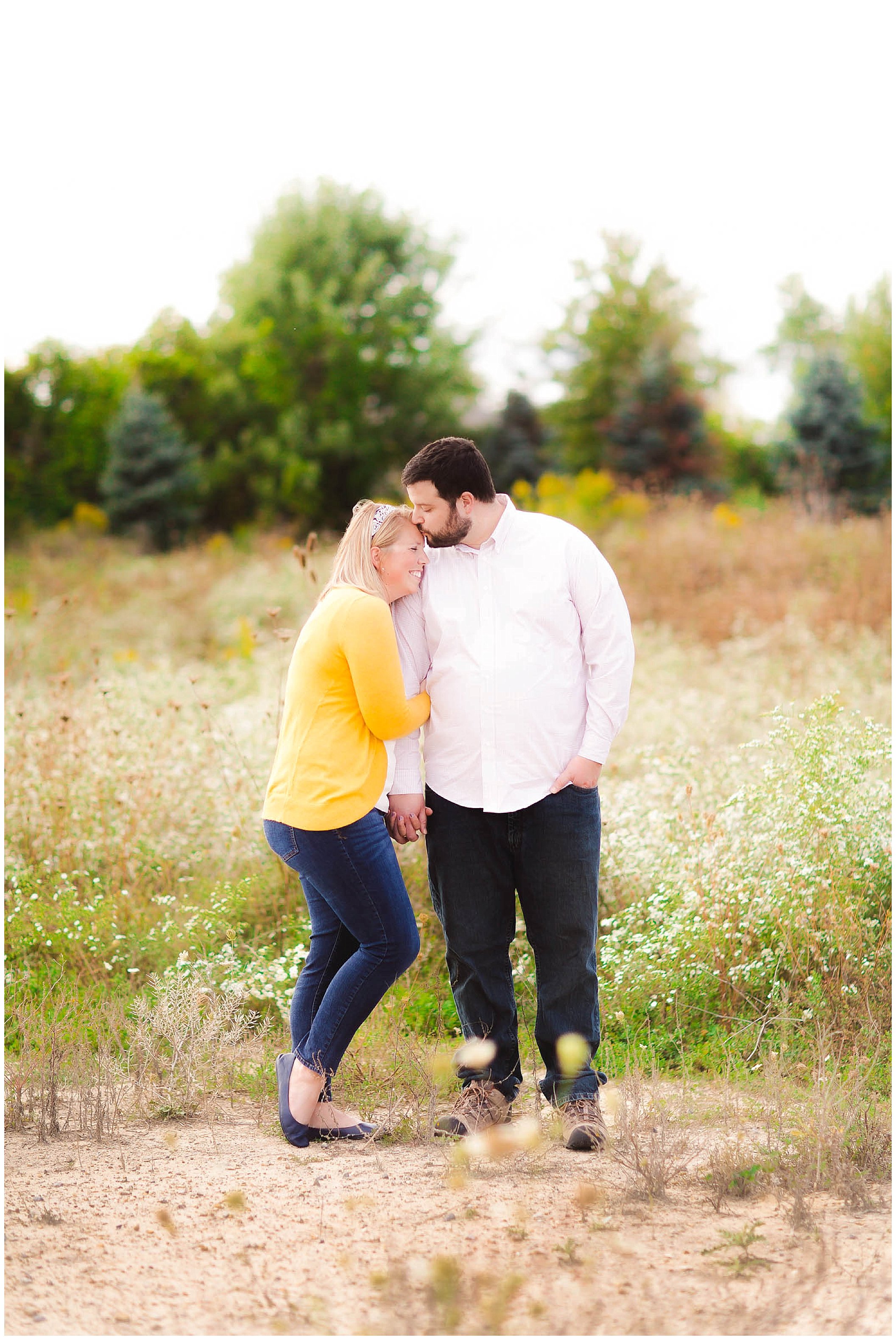 Sunshine filled engagement session in a field of wildflowers, Fort Wayne Indiana Wedding Photographer_0018.jpg