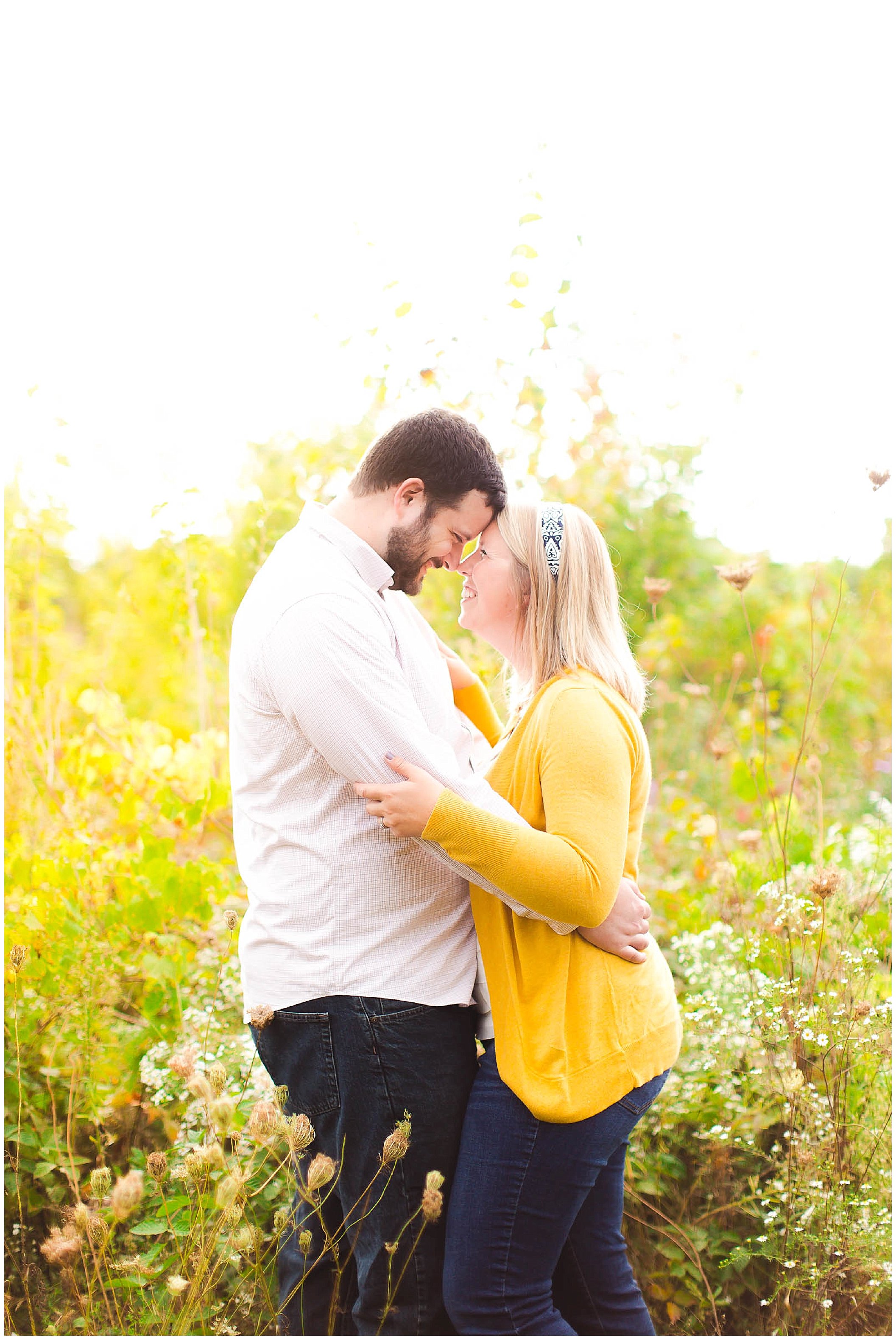 Sunshine filled engagement session in a field of wildflowers, Fort Wayne Indiana Wedding Photographer_0021.jpg