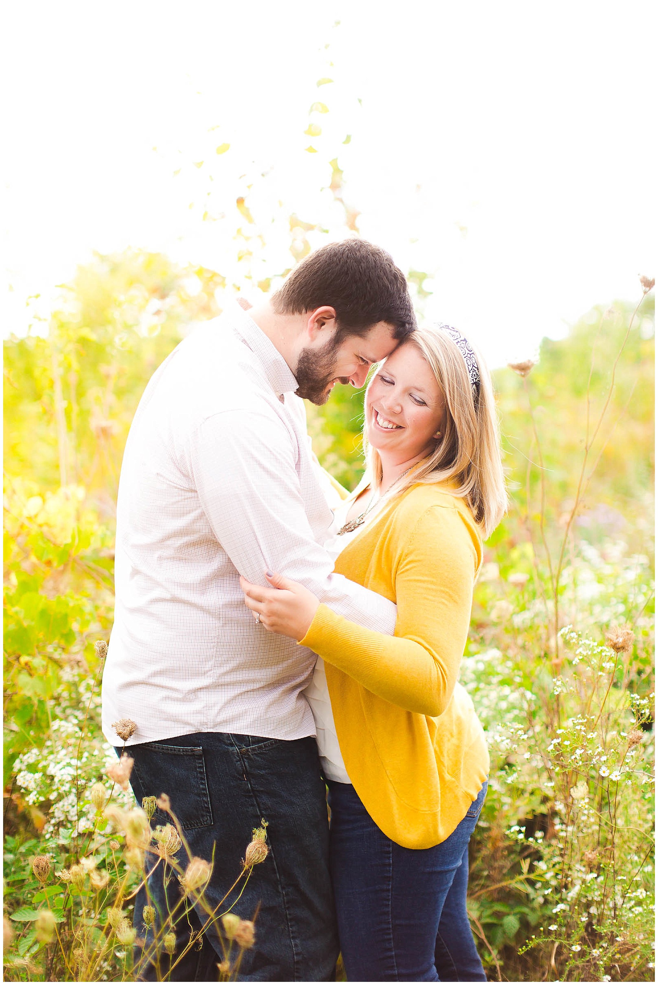 Sunshine filled engagement session in a field of wildflowers, Fort Wayne Indiana Wedding Photographer_0022.jpg