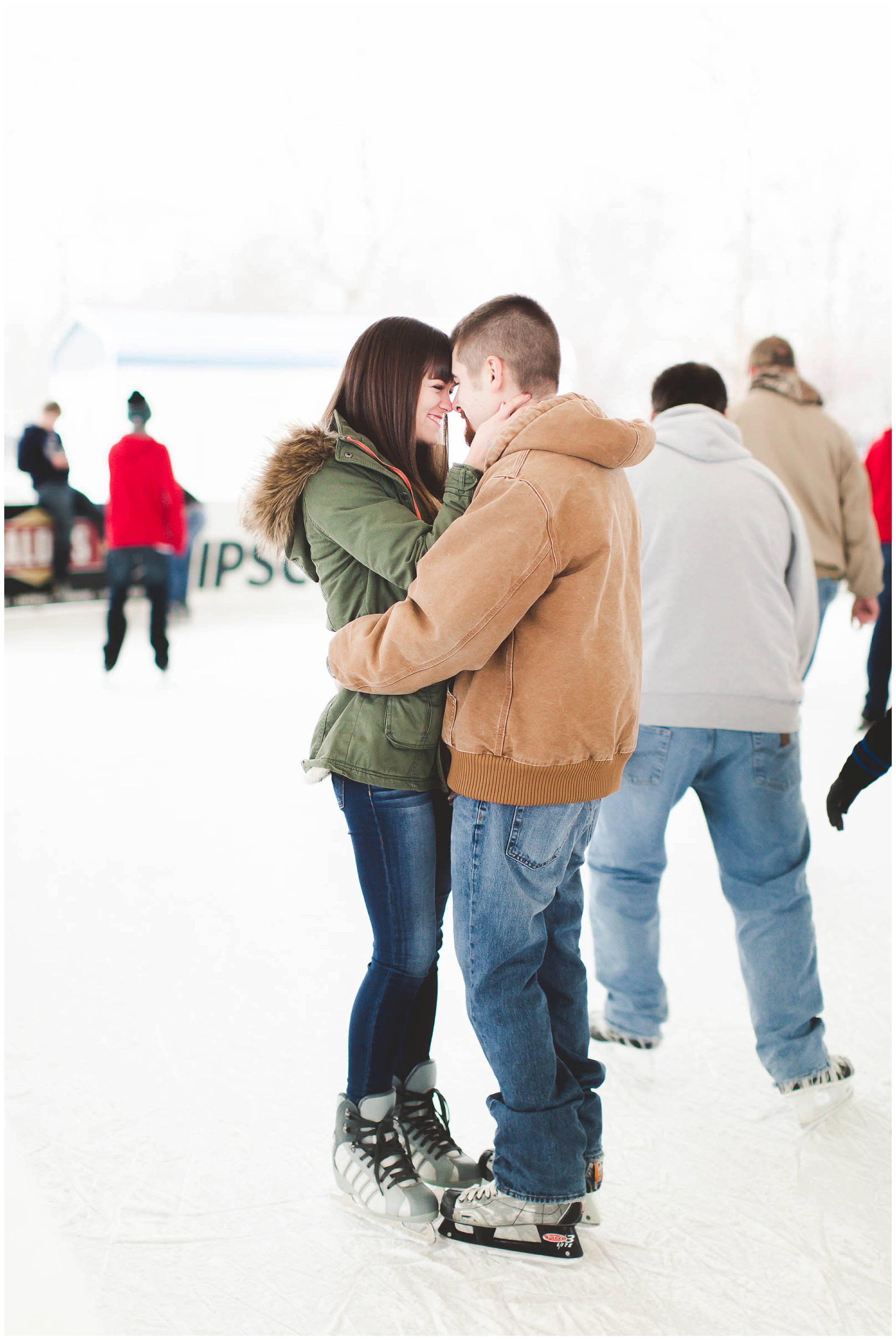 Adorable snowy engagement session at an ice rink while ice skating, Fort Wayne Wedding Photographer_0034.jpg