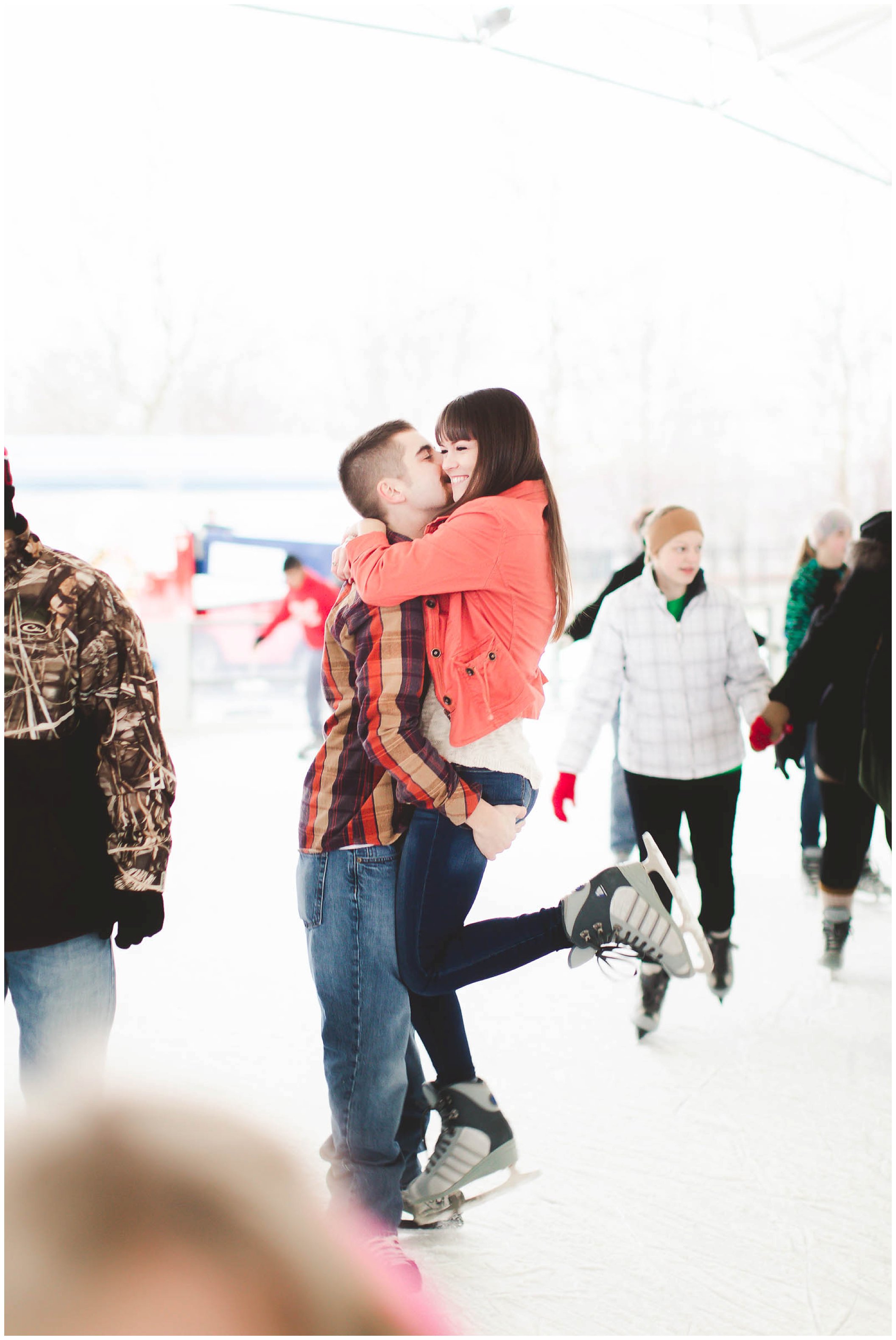 Adorable snowy engagement session at an ice rink while ice skating, Fort Wayne Wedding Photographer_0036.jpg