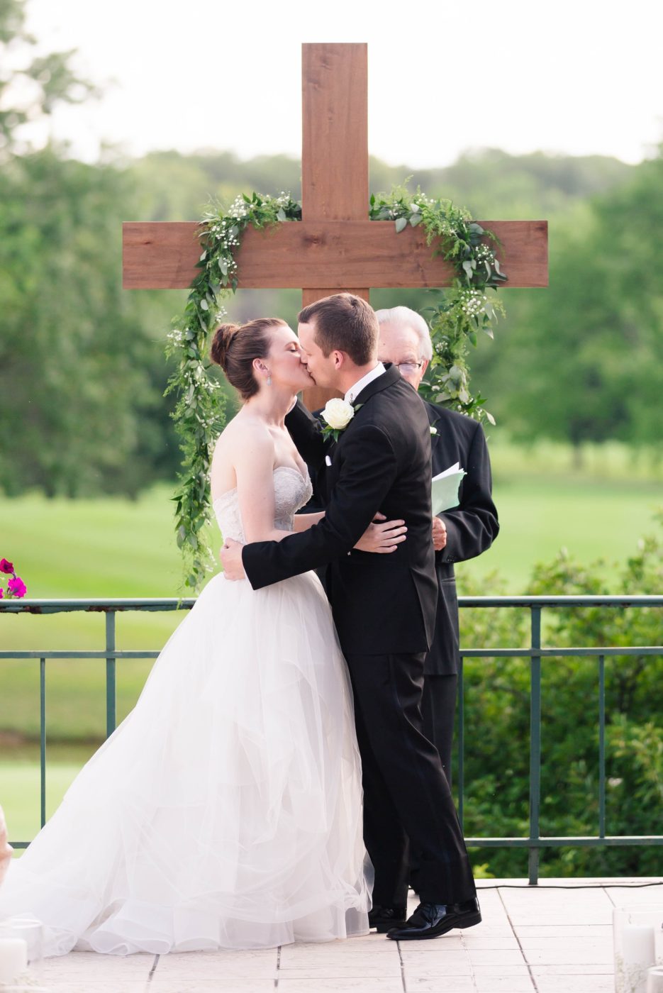 Groom kissing his bride for the very first time after being pronounced husband and wife. 