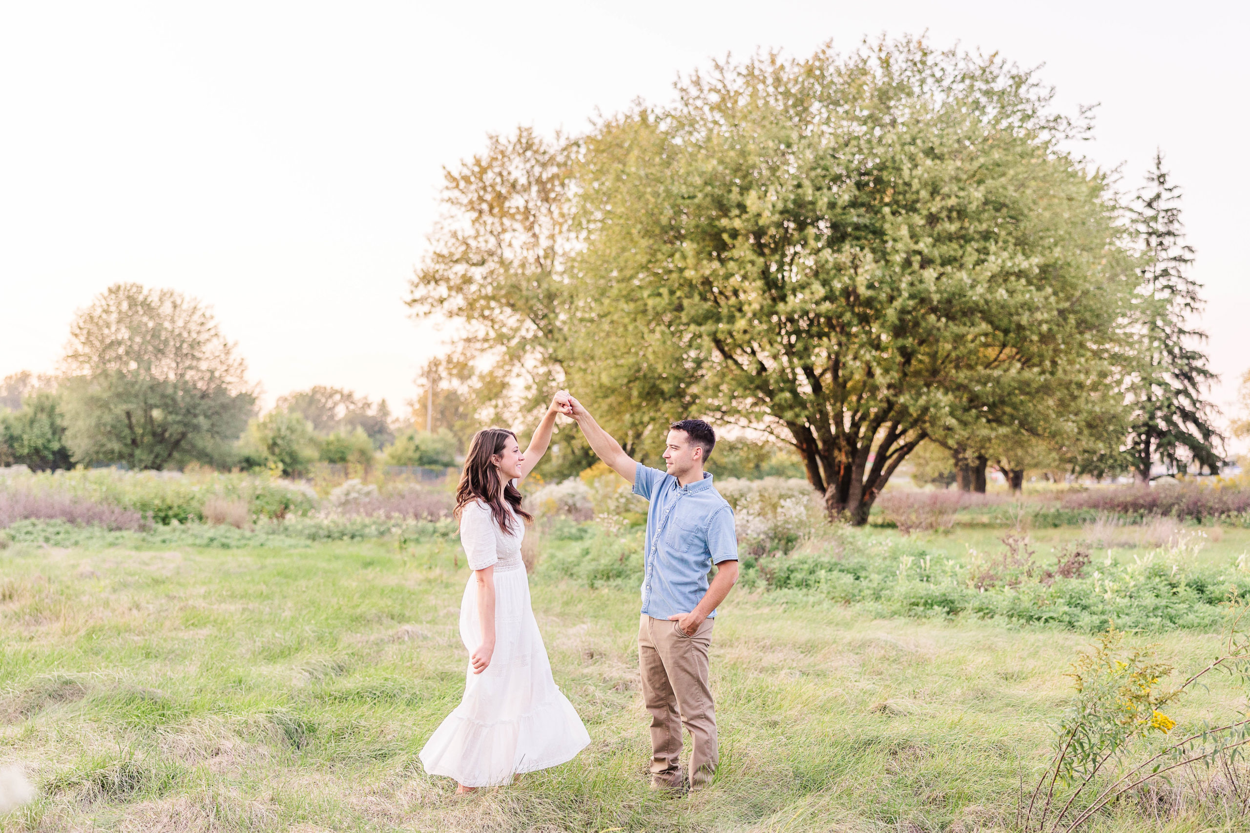 Engagement session in a Field of summer wildflowers.